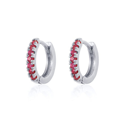 Silver Huggies Earrings showcasing ruby stones on white background.